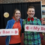 boy and girl posing with signs